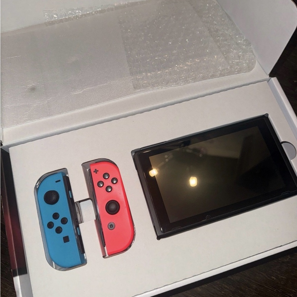 Nintendo Switch with Neon Blue and Neon Red Joy-Con